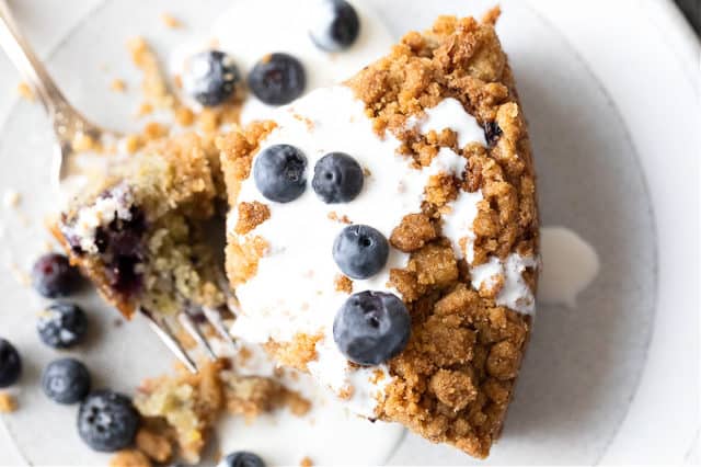 a slice of Grandma’s Secret Blueberry Coffee Cake Recipe