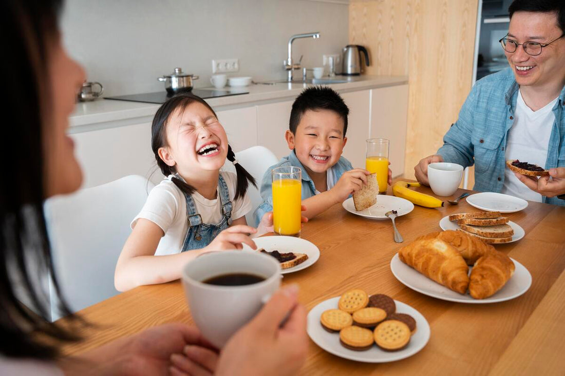 happy family eating breakfast together