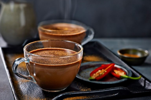 A chocolate milk drink on a tray. 