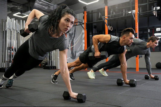 men and woman working out together at the gym
