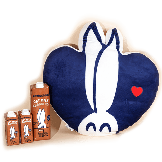 The Chocolate Revolution Bundle consisting of chocolate oatmilk and plushie